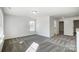 Bright bedroom with grey carpet and access to another room at 5226 Verona Rd # 81, Charlotte, NC 28213