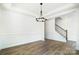 Bright dining room with hardwood floors and a modern chandelier at 5226 Verona Rd # 81, Charlotte, NC 28213