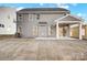 Gray house exterior with covered patio and backyard at 5226 Verona Rd # 81, Charlotte, NC 28213