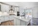 Modern kitchen with white cabinets, gas cooktop, and hexagon tile backsplash at 5226 Verona Rd # 81, Charlotte, NC 28213