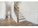 Elegant staircase with a dark wood handrail and white risers at 5226 Verona Rd # 81, Charlotte, NC 28213