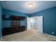 Bedroom with built-in entertainment center at 8428 Loxton Cir, Charlotte, NC 28214