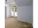 Bedroom with French doors leading to balcony at 8428 Loxton Cir, Charlotte, NC 28214