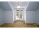 Bedroom with French doors leading to balcony at 8428 Loxton Cir, Charlotte, NC 28214