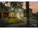 Townhouse exterior featuring two-car garage and well-manicured landscaping at 8428 Loxton Cir, Charlotte, NC 28214