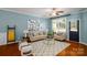 Relaxing living room with neutral-toned furniture and hardwood floors at 8428 Loxton Cir, Charlotte, NC 28214