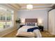 Bright main bedroom with large window, plush bedding, and ample closet space at 8428 Loxton Cir, Charlotte, NC 28214