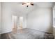 Spacious bedroom with carpet flooring and ensuite bathroom at 112 Bickett Ave, Gastonia, NC 28052