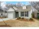 Charming craftsman style home with gray siding, white trim, and a two-car garage at 112 Bickett Ave, Gastonia, NC 28052