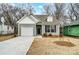 Newly constructed craftsman style home with attached garage and landscaped yard at 112 Bickett Ave, Gastonia, NC 28052