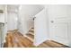 Light-filled hallway with stairs, wood floors and access to other rooms at 112 Bickett Ave, Gastonia, NC 28052