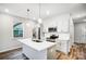 Modern kitchen with white cabinets, stainless steel appliances, and an island at 112 Bickett Ave, Gastonia, NC 28052