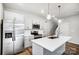 Modern kitchen with white cabinets, stainless steel appliances, and an island at 112 Bickett Ave, Gastonia, NC 28052