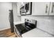 Stainless steel appliances and white cabinets in a modern kitchen at 112 Bickett Ave, Gastonia, NC 28052