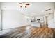 Open living room with vaulted ceiling, LVP flooring, and island kitchen at 112 Bickett Ave, Gastonia, NC 28052