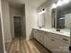 Elegant bathroom with double vanity and white cabinets at 11933 Cabera Ln, Midland, NC 28107