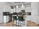 Island kitchen with granite countertops and white cabinets at 11933 Cabera Ln, Midland, NC 28107