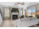 Living room with fireplace, hardwood floors, and large windows at 11933 Cabera Ln, Midland, NC 28107