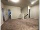 Spacious upstairs hallway with carpet and access to bedrooms at 11933 Cabera Ln, Midland, NC 28107