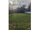 Expansive backyard with lush green grass and ample space at 401 Woodlawn Ave, Cramerton, NC 28032