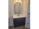 Stylish bathroom vanity with a modern mirror and fixtures at 401 Woodlawn Ave, Cramerton, NC 28032