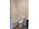 Well-lit bathroom featuring a bathtub with shower, sleek vanity, and modern fixtures at 401 Woodlawn Ave, Cramerton, NC 28032