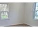 Bright bedroom with hardwood floors and large windows allowing ample natural light at 401 Woodlawn Ave, Cramerton, NC 28032