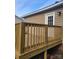 New wooden deck and beige siding on a home exterior at 401 Woodlawn Ave, Cramerton, NC 28032