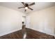 Bright bedroom with dark hardwood floors and ceiling fan at 2186 W Nc 10 Hwy, Newton, NC 28658