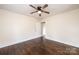Well-lit bedroom with hardwood floors and ceiling fan at 2186 W Nc 10 Hwy, Newton, NC 28658