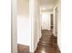 Long hallway with hardwood floors and built-in storage at 2186 W Nc 10 Hwy, Newton, NC 28658