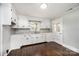 Bright kitchen with white cabinets, modern backsplash, hardwood floors, and natural light at 2186 W Nc 10 Hwy, Newton, NC 28658