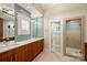 Elegant bathroom with double vanity, large mirror, and walk-in shower at 2526 Normandy Rd, Charlotte, NC 28209