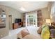 Large bedroom with private balcony and colorful curtains at 2526 Normandy Rd, Charlotte, NC 28209