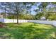 Spacious backyard with a grassy lawn and a white fence at 2844 Georgia Ave, Charlotte, NC 28205