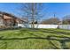 Large backyard with grassy lawn and white vinyl fence at 2844 Georgia Ave, Charlotte, NC 28205