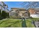 Landscaped backyard with pergola, screened porch, and lush greenery at 2844 Georgia Ave, Charlotte, NC 28205