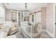 Bedroom featuring a crib and built in closet at 2844 Georgia Ave, Charlotte, NC 28205