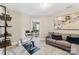 Bonus room includes a couch, stationary bike and shelving unit at 2844 Georgia Ave, Charlotte, NC 28205