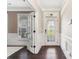 Bright entryway with hardwood floors, french doors, and a decorative glass door at 2844 Georgia Ave, Charlotte, NC 28205