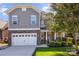 Two-story home with gray siding, stone accents, and a two-car garage at 2844 Georgia Ave, Charlotte, NC 28205