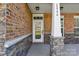White front door with brick and stone accents at 2844 Georgia Ave, Charlotte, NC 28205