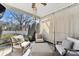 Relaxing screened porch with comfortable seating and ceiling fan at 2844 Georgia Ave, Charlotte, NC 28205