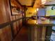 Basement bar with decorative wood paneling at 4000 Wilson Ln, Charlotte, NC 28206