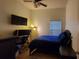Comfortable bedroom with hardwood floors, natural light and desk area at 4000 Wilson Ln, Charlotte, NC 28206