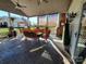 Relaxing covered patio with a seating area, ceiling fans, and brick columns at 4000 Wilson Ln, Charlotte, NC 28206