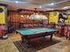 Game room with a pool table and a custom-built bar area for entertainment at 4000 Wilson Ln, Charlotte, NC 28206