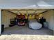Interior view of a multi-car garage with car lifts and ample storage space, perfect for automotive enthusiasts at 4000 Wilson Ln, Charlotte, NC 28206