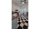 Well-lit kitchen with modern appliances and a black-and-white checkered floor at 4000 Wilson Ln, Charlotte, NC 28206
