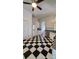 Open kitchen area with black-and-white tile flooring, and modern appliances at 4000 Wilson Ln, Charlotte, NC 28206